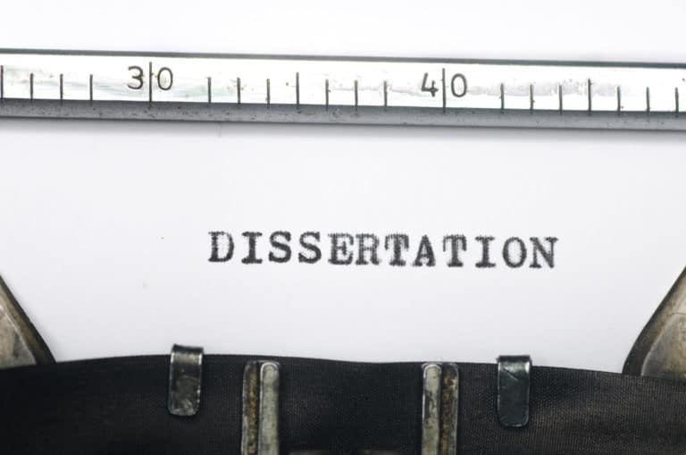 ‘Dissertation’ typed on paper still in a typewriter.
