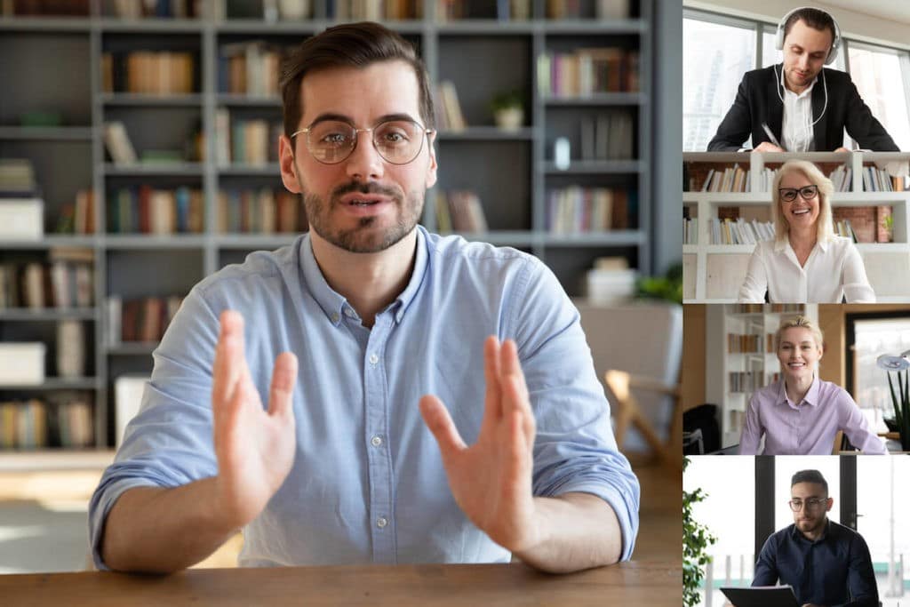 Man talking to his colleagues over a video call.