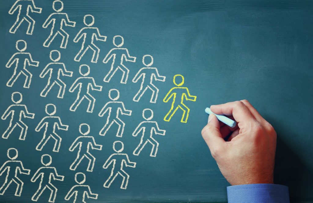 Drawings of small figures on a chalkboard.
